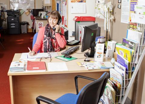 Image of one of our receptionists taking a telephone call Image of one of our receptionists taking a telephone call